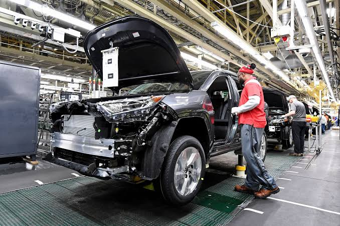 Advanced automotive factory using industrial robots as Toyota accelerates manufacturing automation